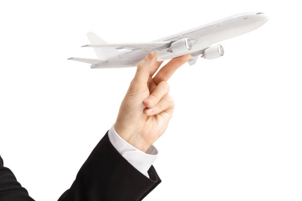 istock Male hand holding a model airplane 1442155333