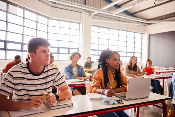 istock Diverse group of students listening to a lecture in a classroom 1442156201