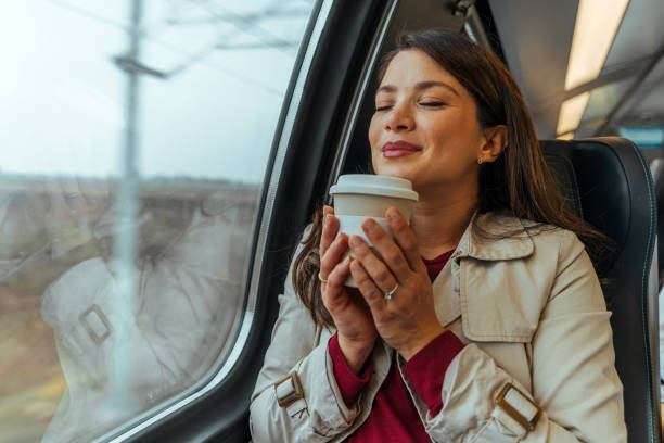 istock Commuter on train enjoying in cup of fresh coffee 1442157412