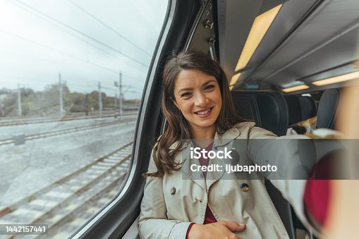 istock Pretty girl tourist takes selfie at the train. 1442157441