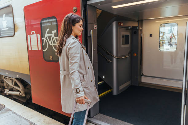istock Woman boarding the train on the empty train station 1442157455
