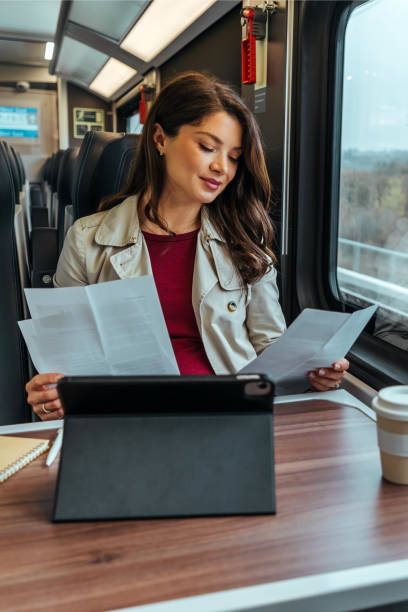istock Smiling businesswoman multitasking with paperwork 1442157591