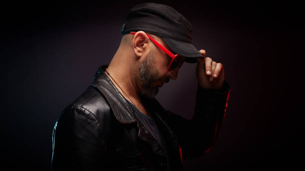 Stylish Handsome Man Wearing Leather Jacket With Red Sunglasses Looking  Down Stock Photo - Download Image Now - iStock