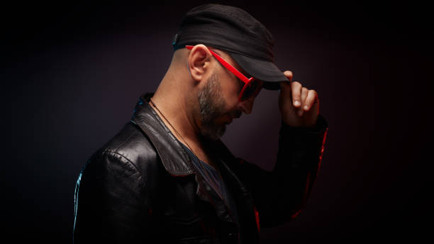 Stylish Handsome Man Wearing Leather Jacket With Red Sunglasses Looking Down Stock Photo - Download Image Now - iStock Stylish Handsome Man Wearing Leather Jacket With Red Sunglasses Looking Down Stock Photo - Download Image Now - iStock