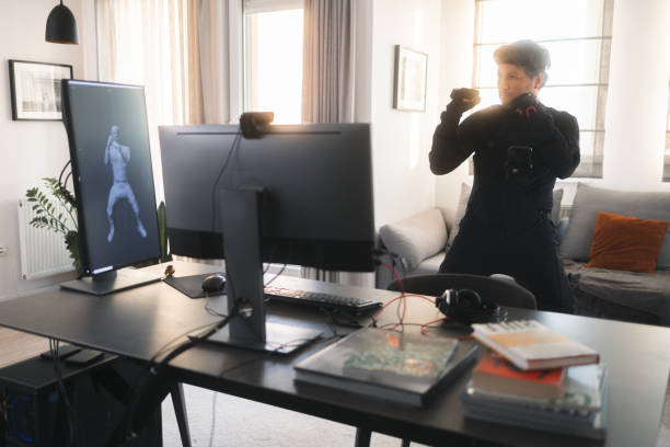 istock A Caucasian guy is creating a 3d animation by using a mock-up smart suit. 1442159113