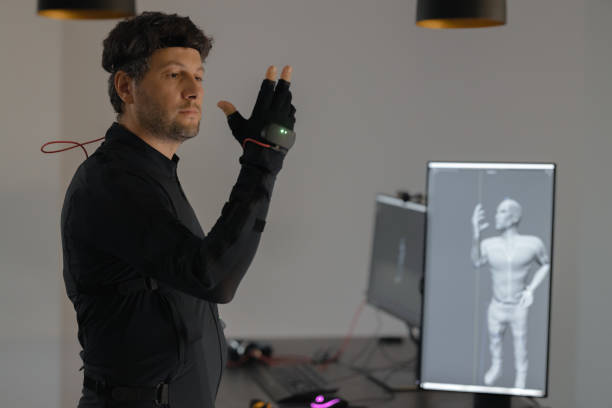 istock A Caucasian guy is creating a 3d animation by using a mock-up smart suit. 1442159130
