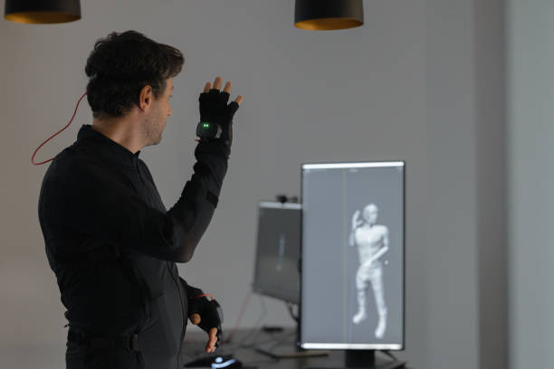 istock A Caucasian guy is creating a 3d animation by using a mock-up smart suit. 1442159136