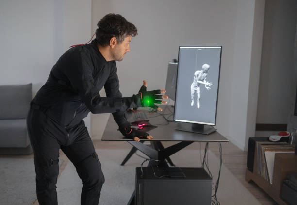 istock A Caucasian guy is creating a 3d animation by using a mock-up smart suit. 1442159153