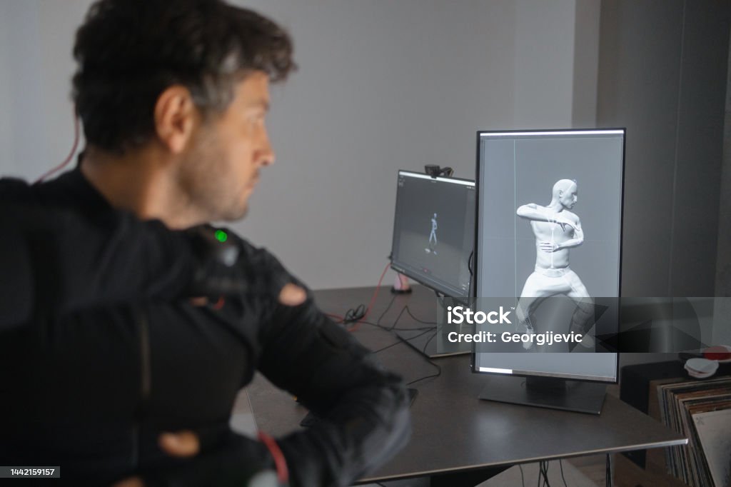 A Caucasian Guy Is Creating A 3d Animation By Using A Mockup Smart Suit  Stock Photo - Download Image Now - iStock