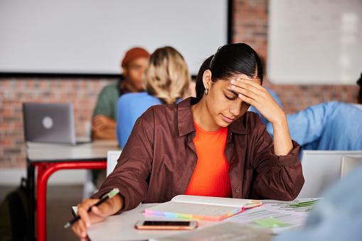 Scared While Study Young Student Looking Stressed While Studying In A Classroom Stock ...