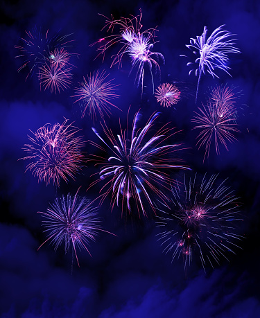 Set of fireworks on a night blue sky background.