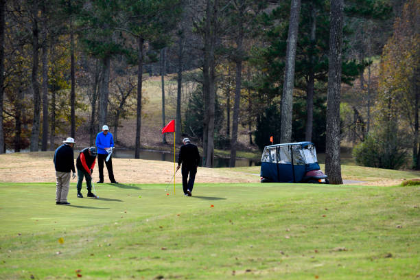 Young black african american man carrying golf clubs, looking strong and relaxed.