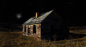 Starry night with one bright star over an old house