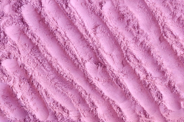 istock Pale pink cosmetic clay powder (alginate modeling facial mask, eye shadow, blush, body wrap) texture close-up, selective focus. Abstract background with brush strokes. 1442165587