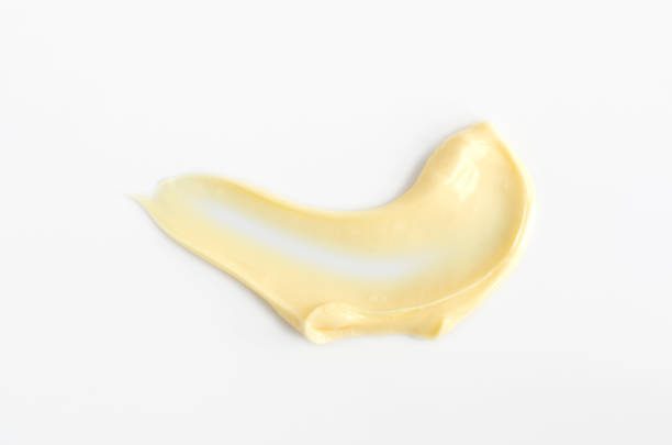 istock Yellow beauty mask (banana face cream, shea butter facial mask, body butter) swatch. Brush stroke with cream texture macro on a light background. 1442166070