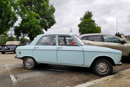 Huelgoat, France - September 09 2021: The Peugeot 204 is a small family car produced by the French manufacturer Peugeot between 1965 and 1976.