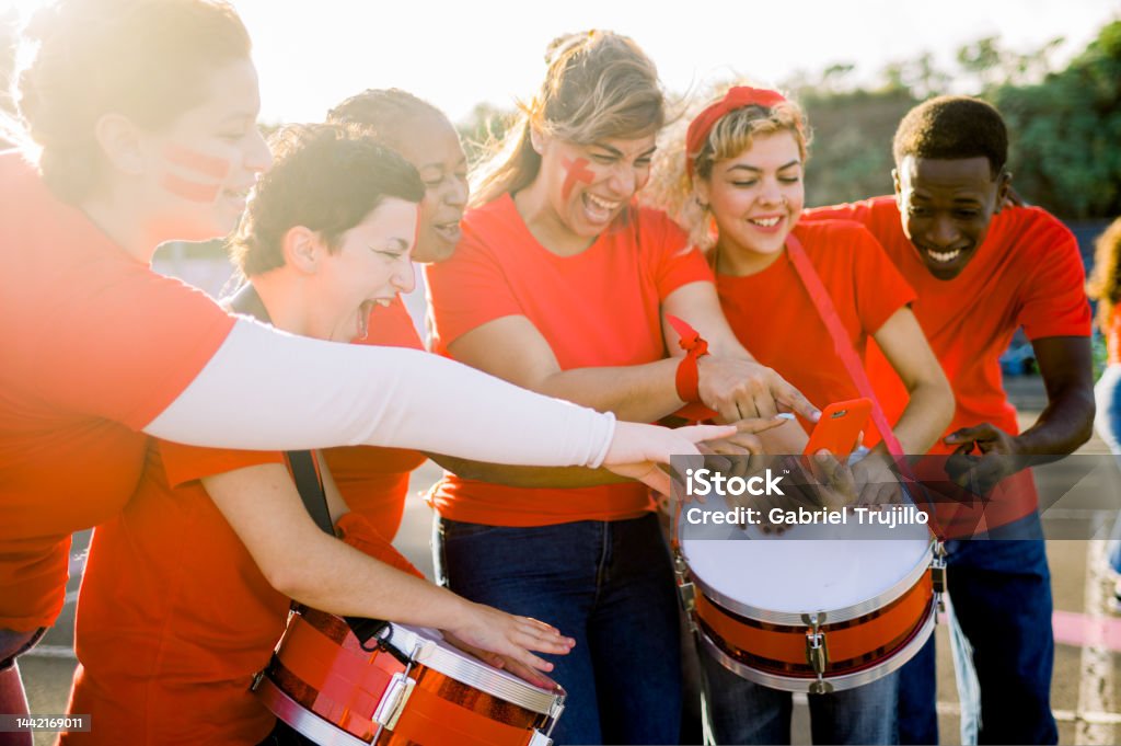 Group of men playing drums Group of multiethnic men and women playing drums while spending time together Adult Stock Photo