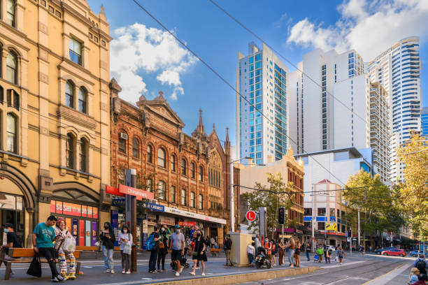 Chinatown light rail stop in Sydney city Sydney, Australia - April 16, 2022: Chinatown light rail stop with people waiting for tram on a bright day in Sydney City st george street stock pictures, royalty-free photos & images