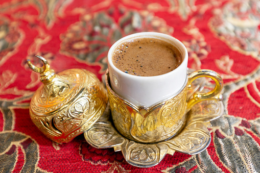 A cup of Turkish coffee on a decorated table