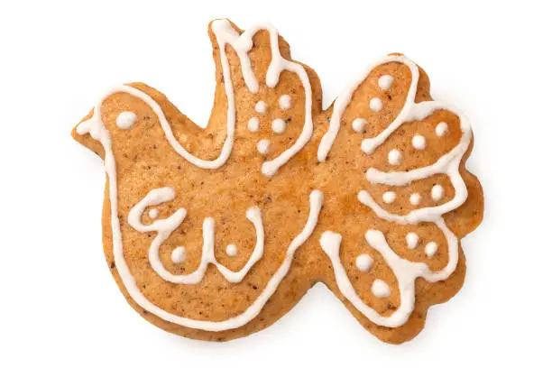 Decorated Christmas gingerbread cookie isolated on white. Top view.