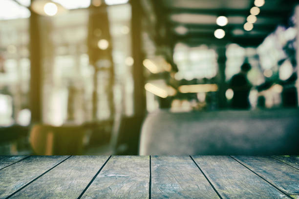 istock Old Wooden Table with Blurred of Restaurant Background. 1442173354