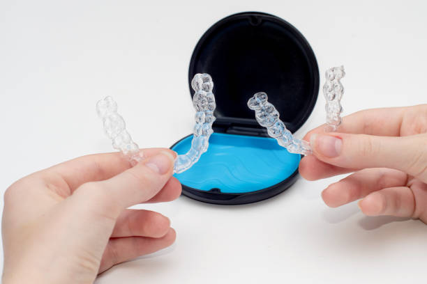 istock Transparent aligners and storage case. Invisible braces. Clear teeth straighteners. Plastic bracers 1442178542