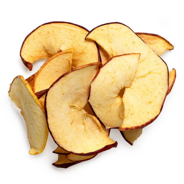 istock Pile of dried apple slices isolated on white from above. 1442178590