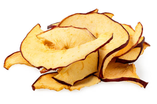 istock Pile of dried apple slices isolated on white. 1442179213