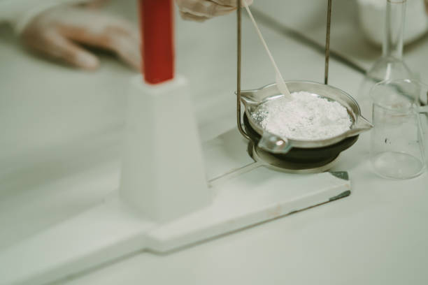 istock Laboratory study concept, test chemistry laboratory in classroom for student, close up hand balance wight chemical substance on blurred background, safety gloves on hand of chemist for learning class 1442180931