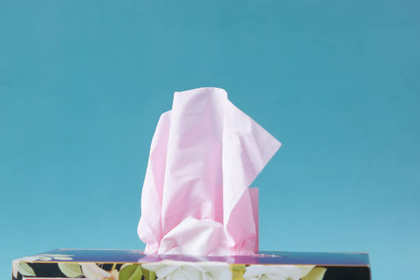 istock hand pull out a piece of tissue from tissue paper box 1442183033
