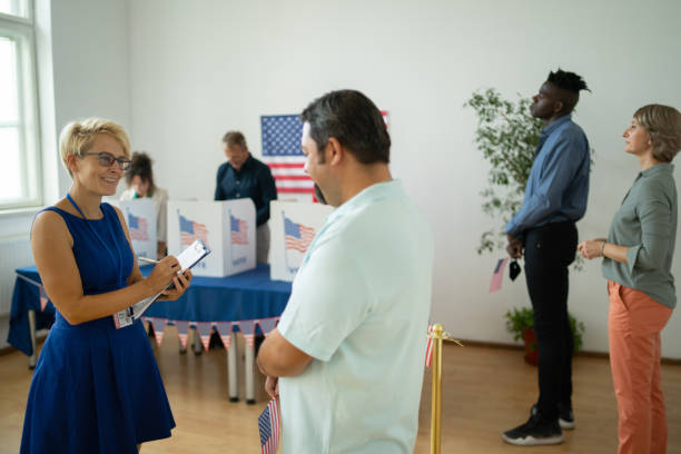 istock Female journalist interviewing a man on Election Day 1442184268