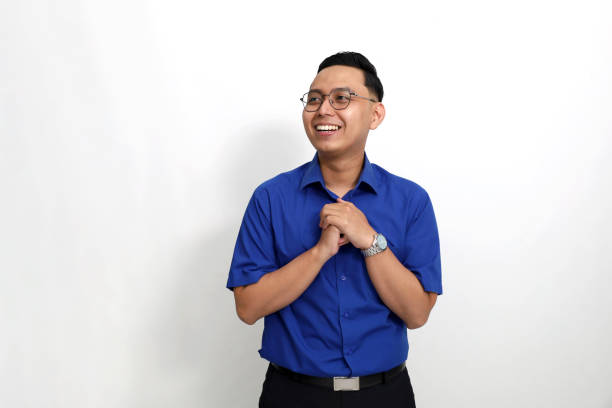 istock Amazed Happy young asian man standing while looking beside him. Isolated on white background with copyspace 1442185262