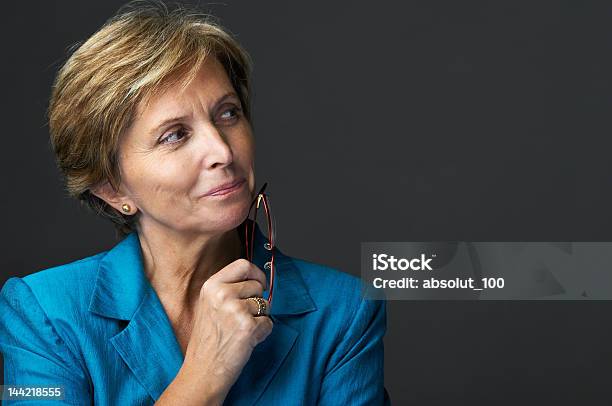 Mid Adult Businesswoman Stock Photo - Download Image Now - Contemplation, Businesswoman, Women