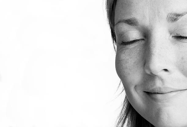 A black & white photo of a woman's face
