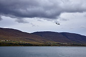 Small passenger airplane descending at Akureyri in North Iceland