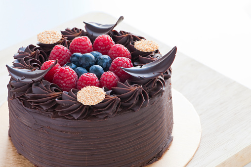 close up of berry fruit chocolate cake