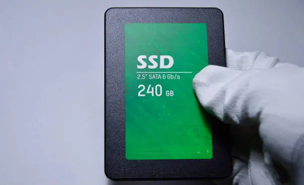 Photo of Close-up photo of 2.5 SSD hard drive, empty on white background.