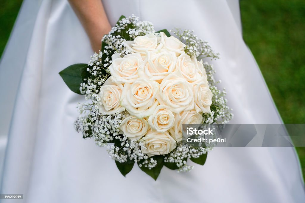 Bride's grove Beautiful white roses in the boquet. Awe Stock Photo