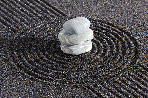 textured sand and stone in Japanese zen garden