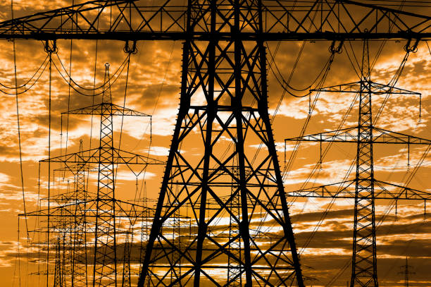 pylons and high voltage cable for electricity and energy stock photo