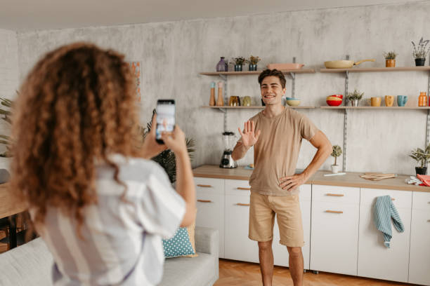 istock Girlfriend Filming Her Boyfriend At Home 1442193957