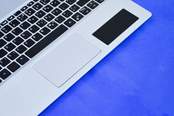 istock front view of white laptop on blue background 1442194758