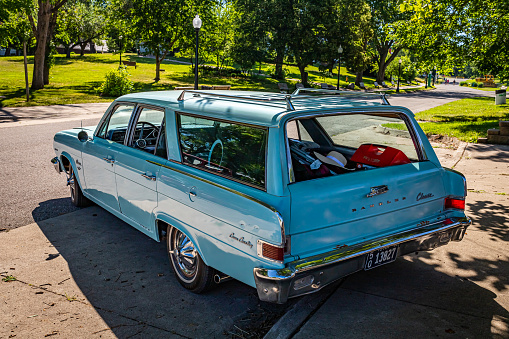 Des Moines, IA - July 03, 2022: High perspective rear corner view of a 1965 AMC Rambler Classic 550 Cross Country Station Wagon at a local car show.
