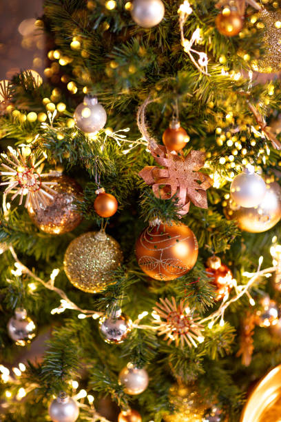 istock Christmas tree with ornaments on Christmas eve with string lights 1442198795