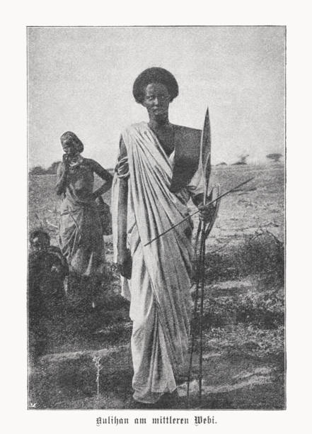 Aulihan people, Somali clan, Kenya/Somalia, halftone print, published in 1899 Historical view of Aulihan people at the middle Webi Gestro, Kenya/Somalia.  The Aulihan (Somali: Cowlyahan; Cawlyan) are a Somali clan, a division of the Ogaden clan, living on both sides of the Kenya - Somalia border. The majorities migrated in response to pressure from the expanding Ethiopian empire and had taken control of the hinterland of the lower Jubba river by the 1870s. The Aulihan today hold the middle Jubba Valley areas north of Gelib. Halftone print after a photograph, published in 1899. african warriors stock illustrations