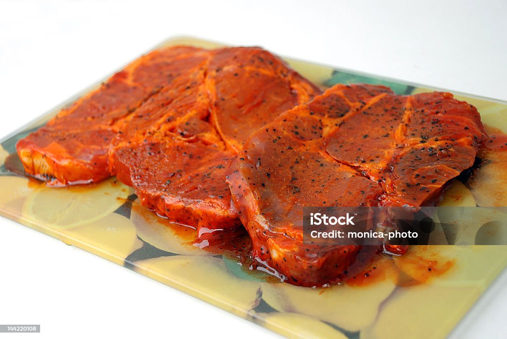 Raw, marinated Pork with spices Raw, marinated Pork with spices. Marinated Stock Photo