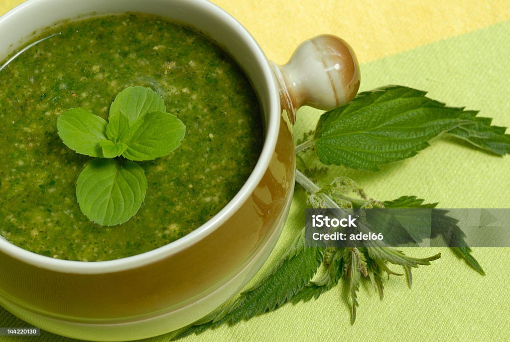 Stringing nettle soup Over view of close to stringing nettle soup  Close To Stock Photo