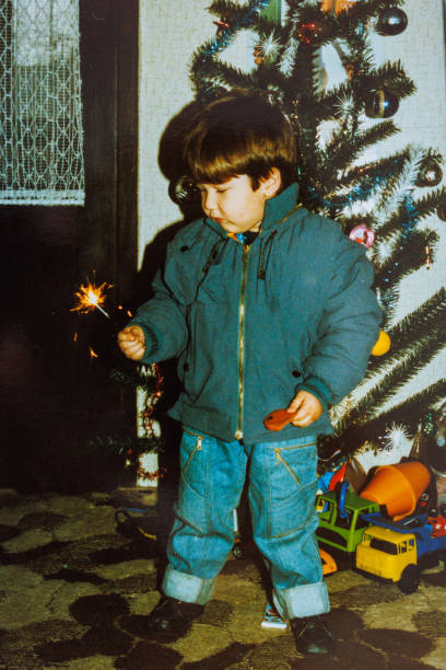 Little boy celebrates Christmas at eighties