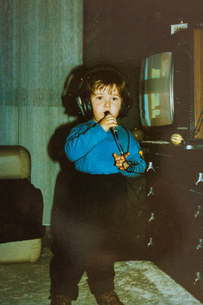 istock Little boy singing at home at eighties 1442205395