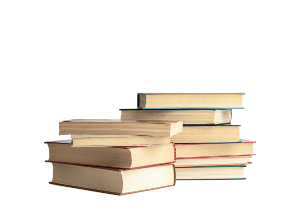 istock Stacks of books in hard and soft covers on a white background. 1442205688